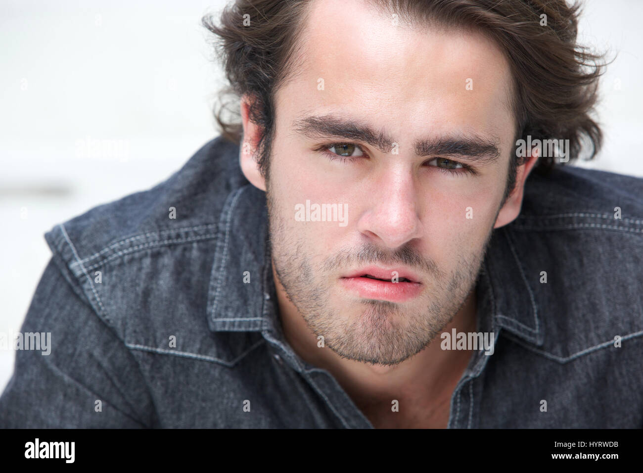 Close up portrait of a young man staring Stock Photo - Alamy