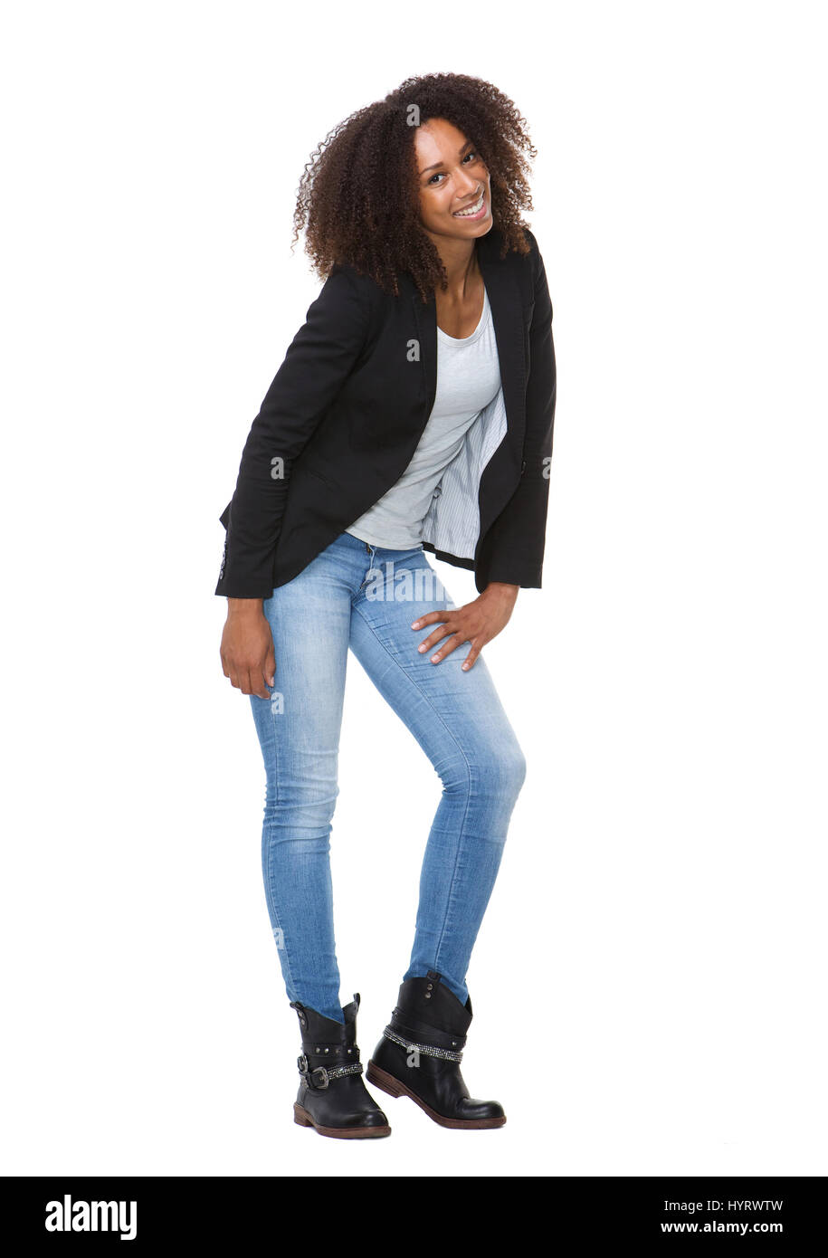 Full length portrait of a young black woman smiling on isolated white ...