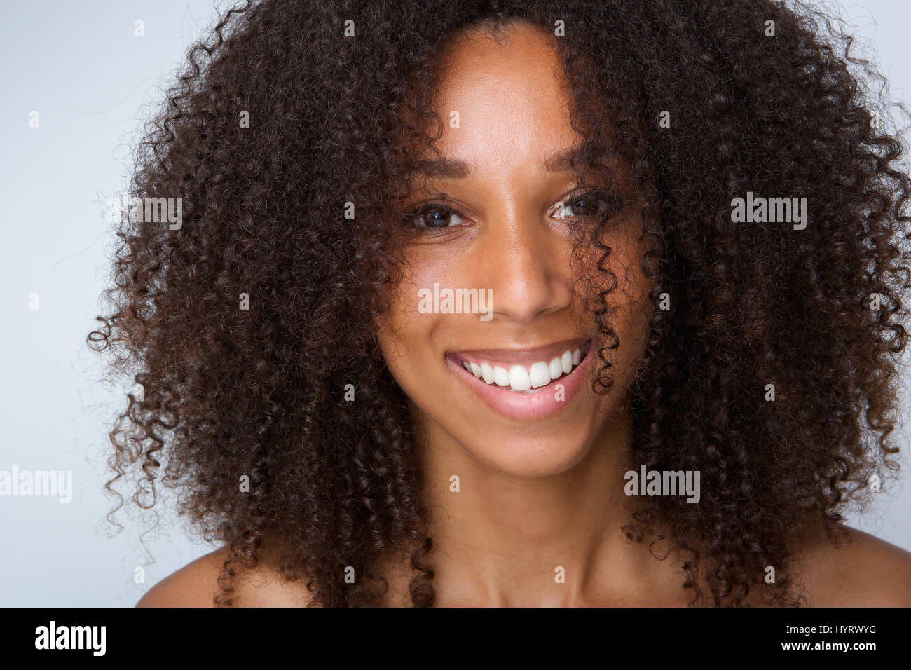 Close up portrait of a young black woman laughing Stock Photo - Alamy