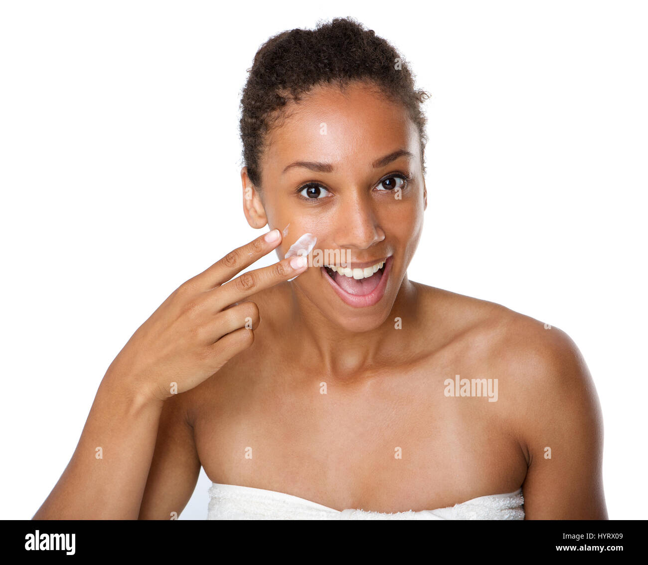 Close Up Portrait Of A Smiling African American Woman Applying Lotion On Skin Stock Photo Alamy