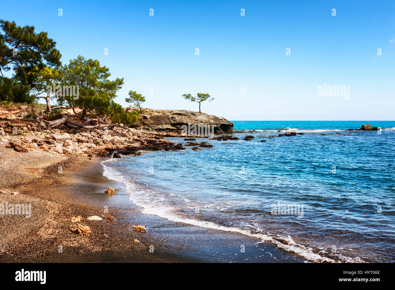 Spring landscape with beach, pines and ruins of ancient city Phaselis, Turkey, travel destination Stock Photo