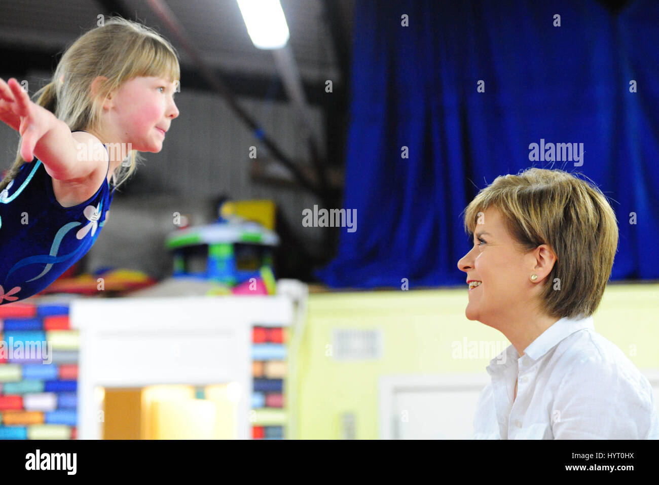 SNP leader and First Minister Nicola Sturgeon watches a young gymnast ...