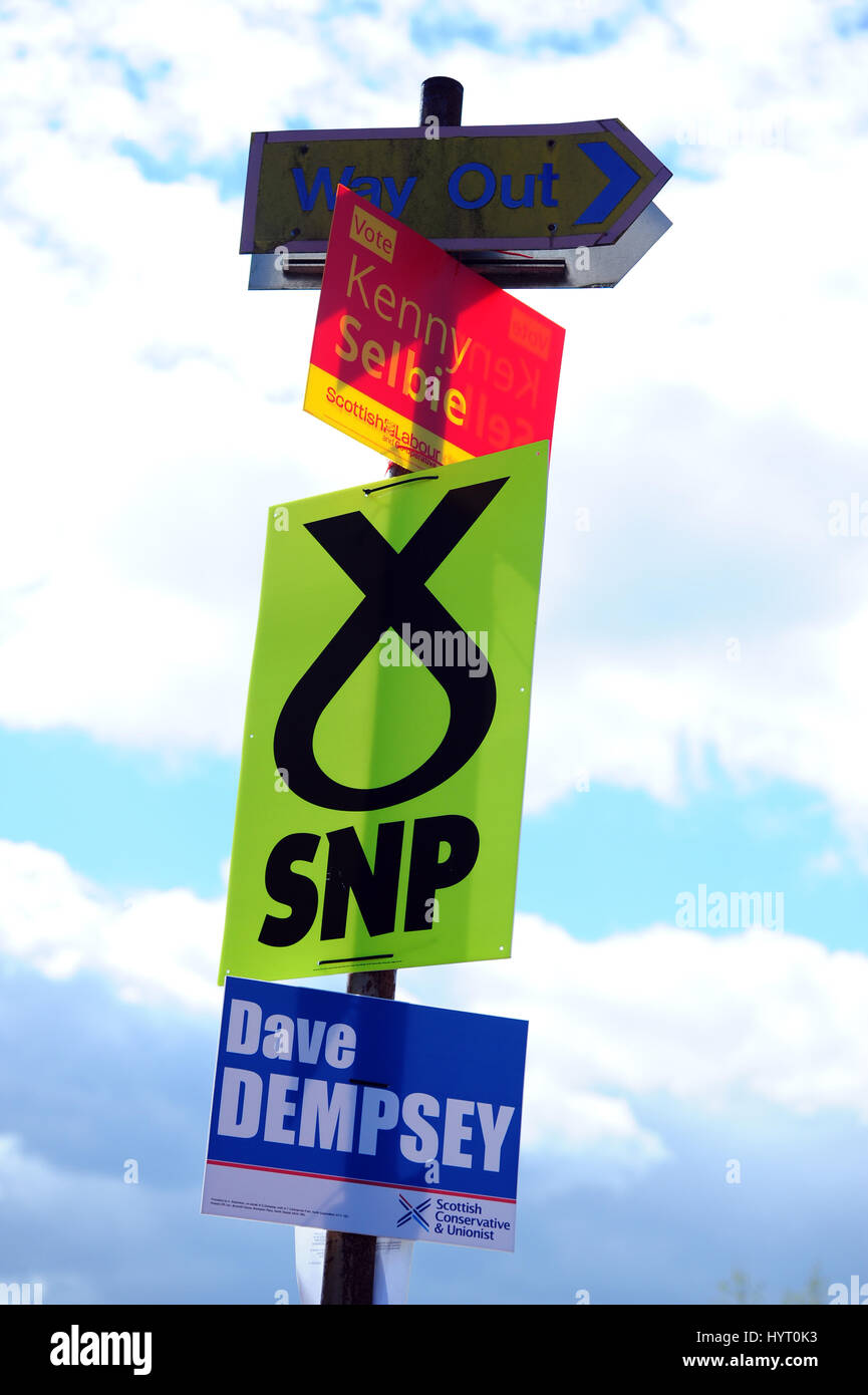 Party placards outside a polling station in Dalgety Bay, in the Kirkcaldy and Cowdenbeath constituency previously represented by former Prime Minister Gordon Brown Stock Photo