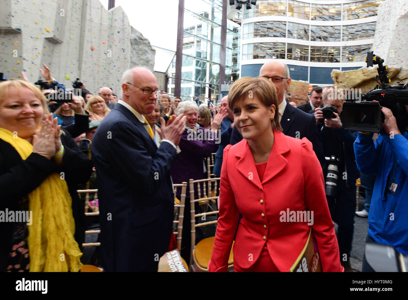 SNP leader and Scottish First Minister Nicola Sturgeon is applauded on her way to the stage to launch the party's general election manifesto Stock Photo