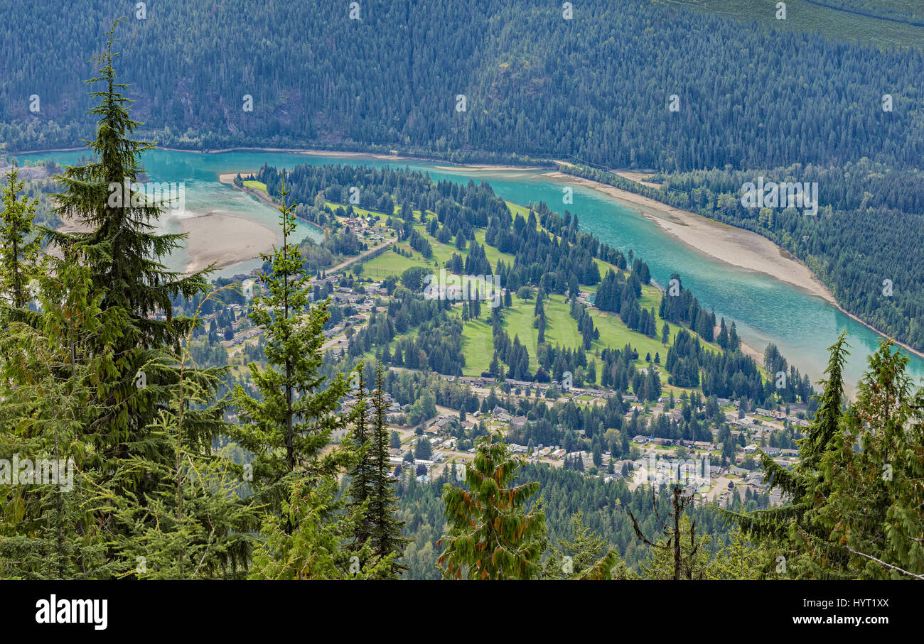An elevated of view of a golf course, Revelstoke townsite and Columbia River. Revelstoke British Columbia Canada Stock Photo