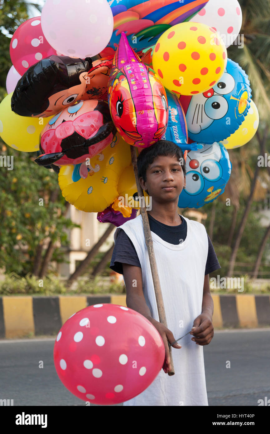 Indian boy selling balloons on Carter Road Promenade, Mumbai, India