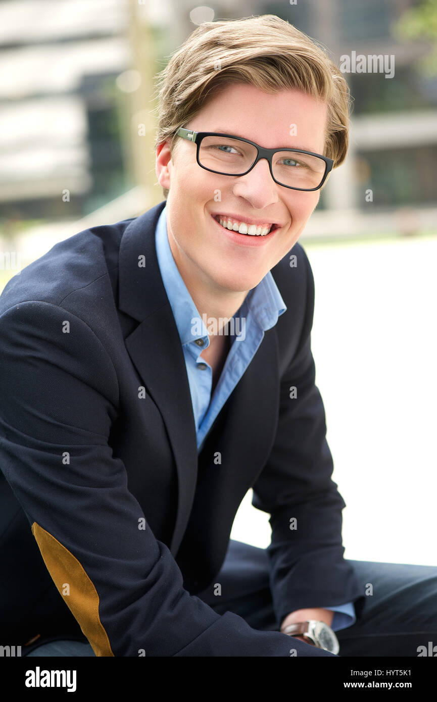 Close up portrait of an attractive young man smiling with glasses Stock ...