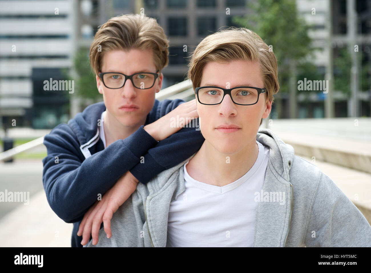 Portrait of two young adult brothers with glasses Stock Photo Alamy