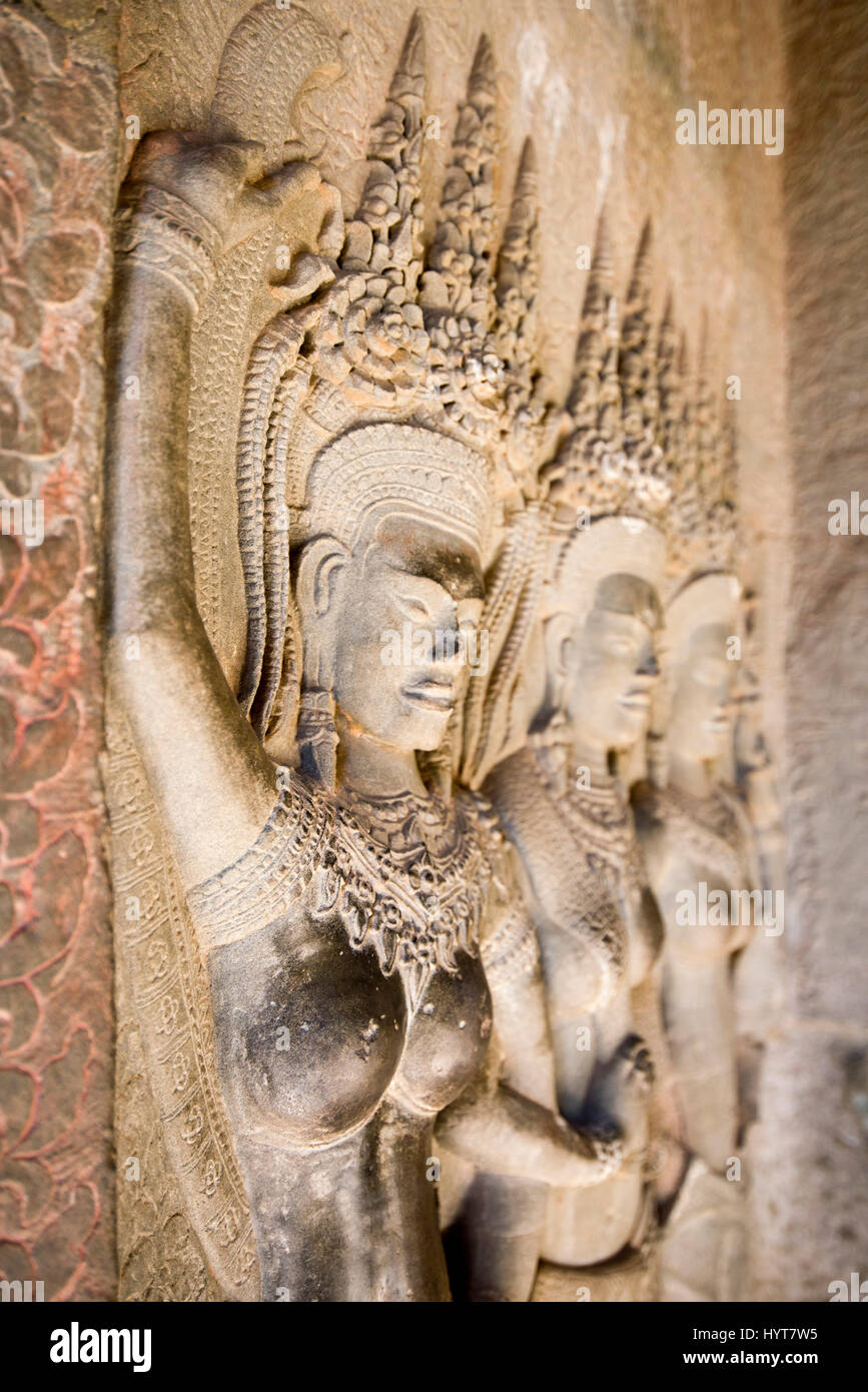 Vertical view of intricate Apsrara dancers on the walls of Angkor Wat in Cambodi Stock Photo