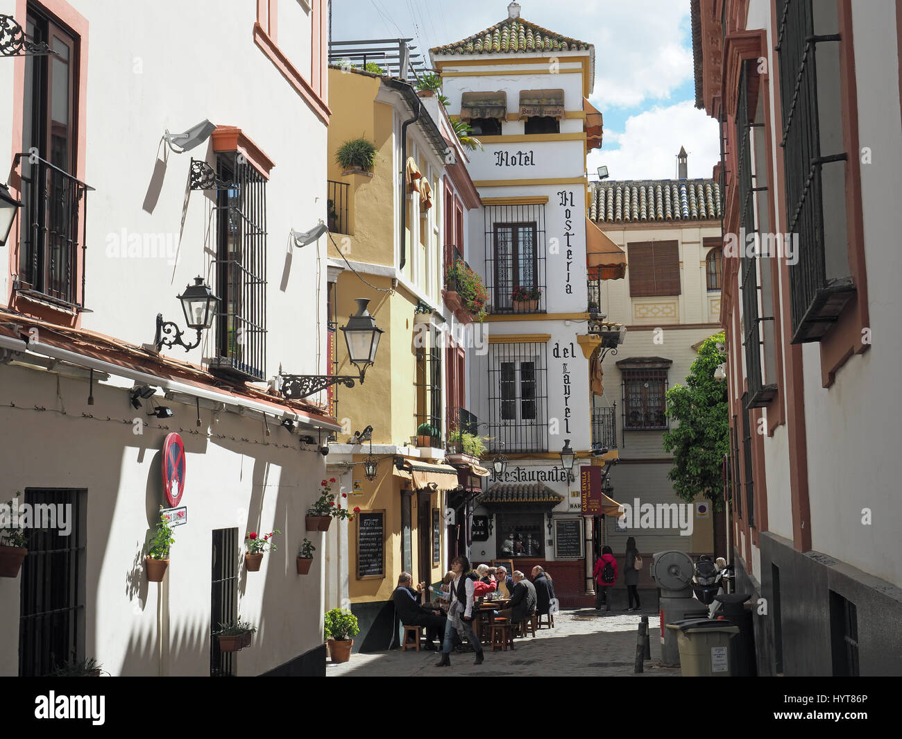 View of a narrow street in the Barrio Santa Cruz district of Seville in Spain Stock Photo