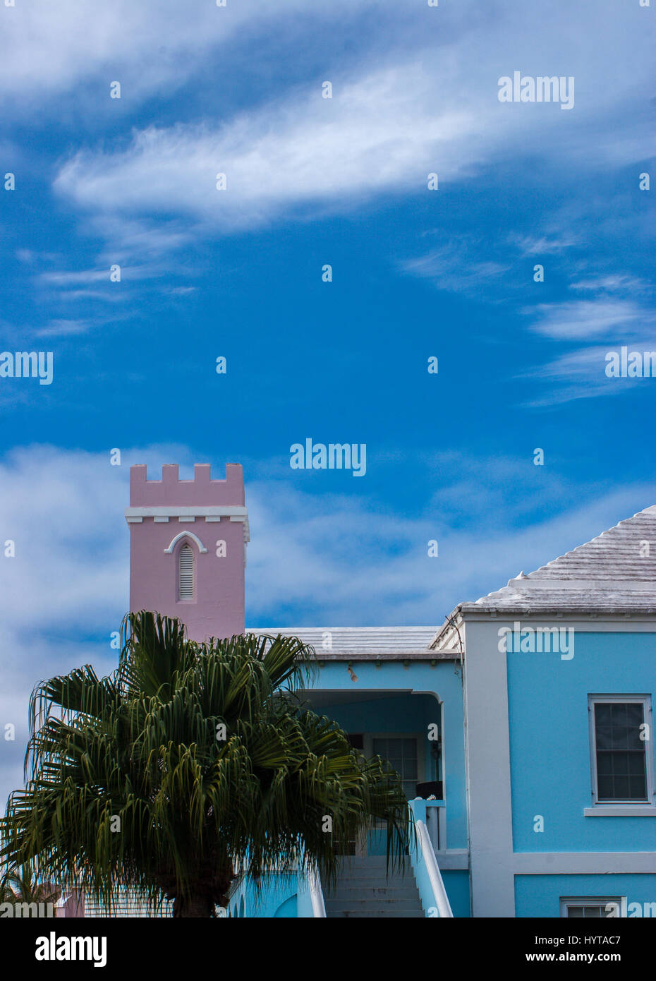 Dwelling house in St George, Bermuda with pink castle like structure. Stock Photo