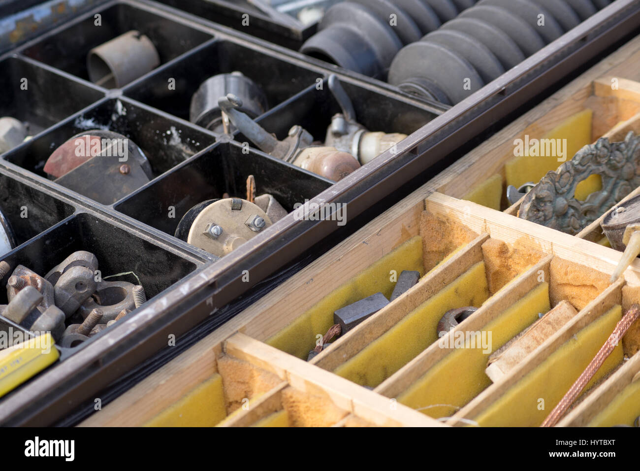 Crates with old spare parts Stock Photo
