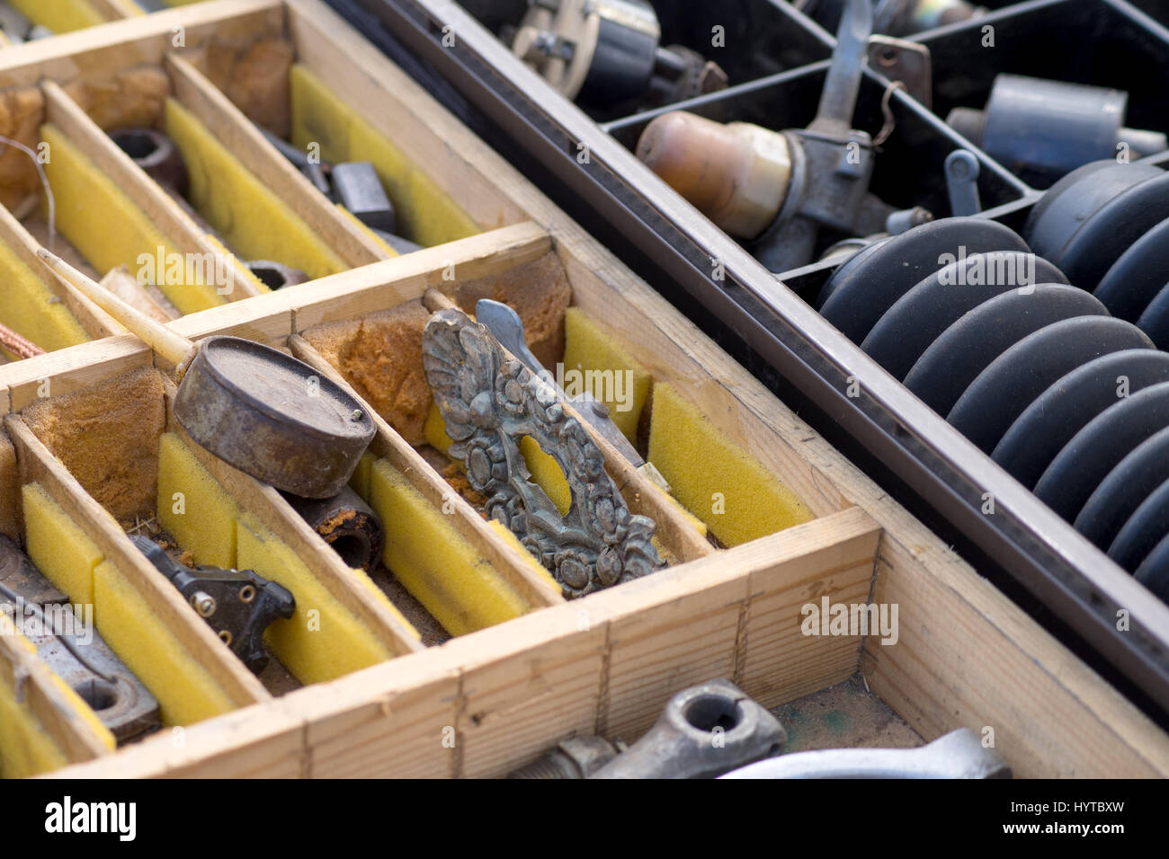 Crates with old spare parts Stock Photo