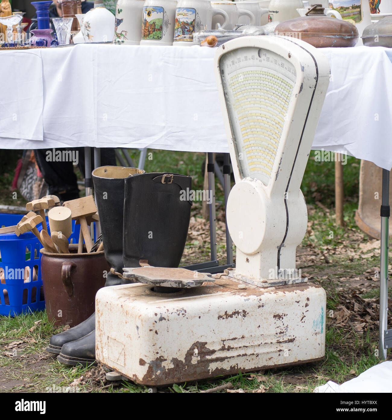 Flea market stall  with old balance and household Stock Photo