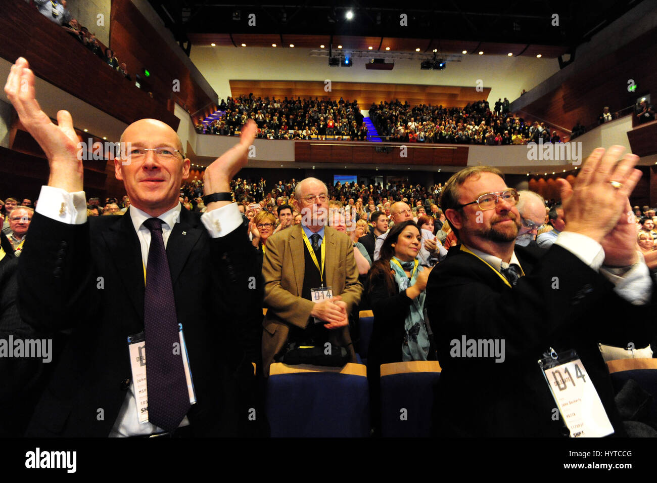 A standing ovation led by Cabinet Secretary for Finance John Swinney (L) after Nicola Sturgeon was officially announced as the new leader of the Scottish National Party at the party's Annual Conference in Perth, Stock Photo
