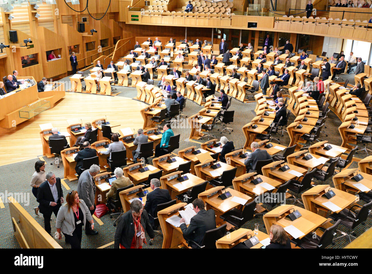 MSPs make their way into the chamber of the Scottish Parliament for a vote on an amendment during the passage of legislation ending automatic early release of prisoners in Scotland Stock Photo