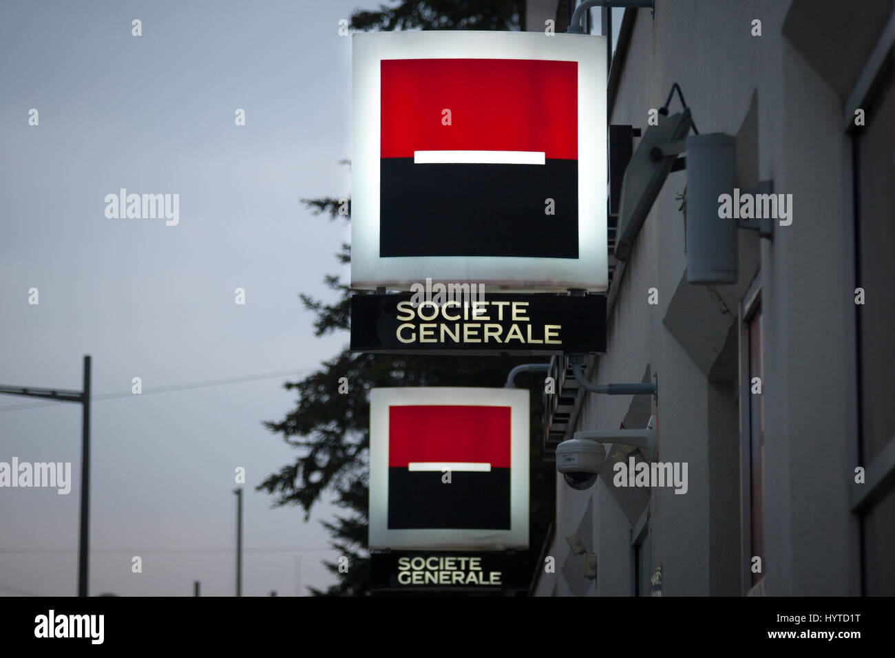 NOVI SAD, SERBIA - MARCH 11, 2017: Logo of the Societe Generale Srbija Bank illuminated in the evening on a branch Novi Sad, Serbia  Picture of an ill Stock Photo