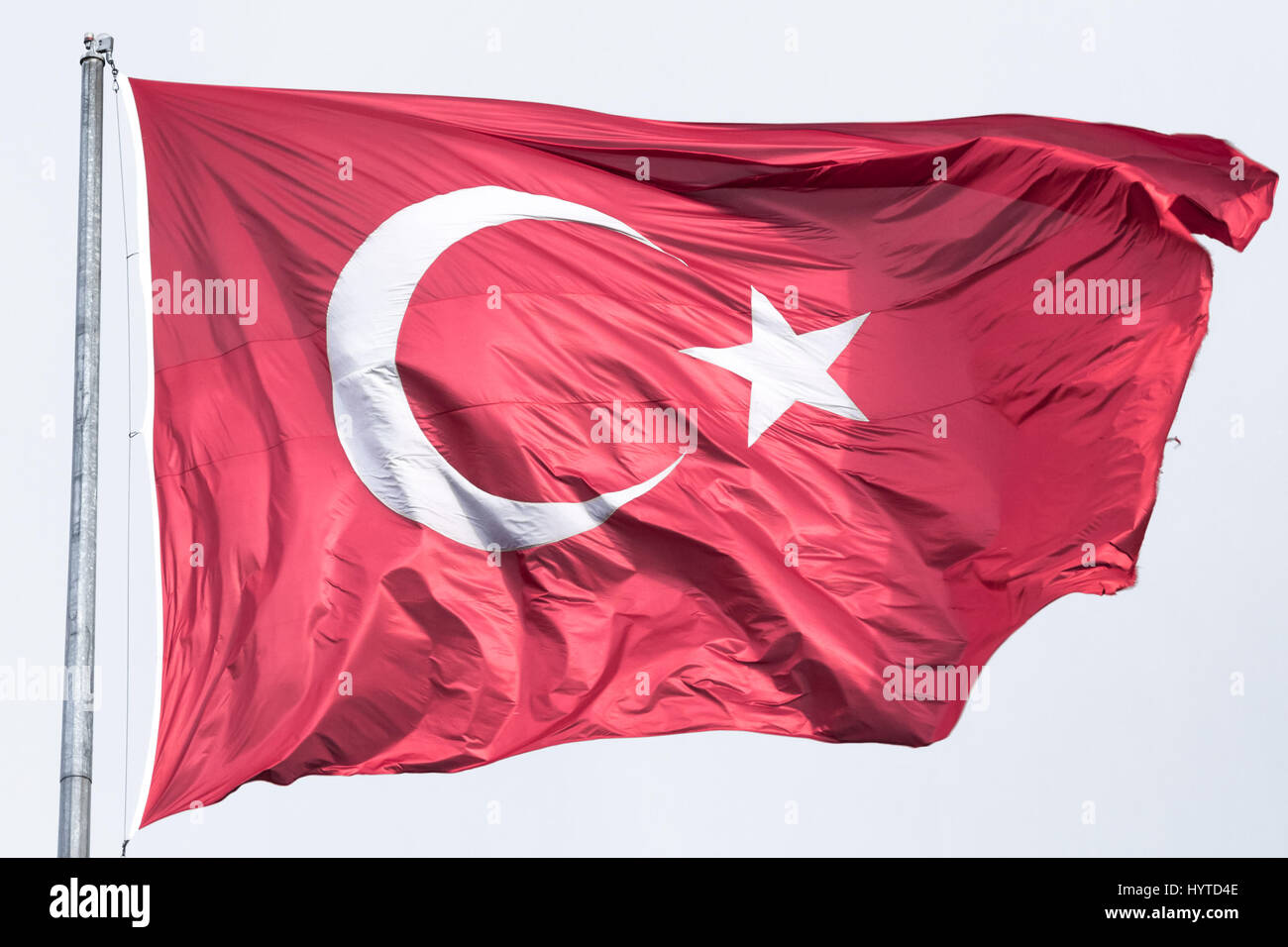 Turkish flag floating in the air  Picture of the official turkish flag hoisted in a windy environment Stock Photo