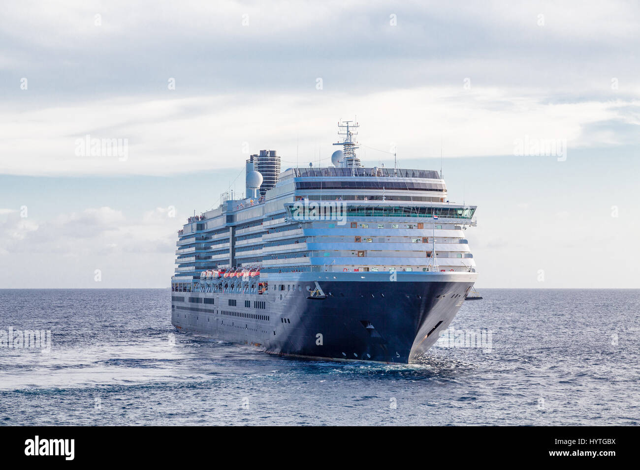 Huge black and white luxury cruise ship sailiing off Stock Photo - Alamy