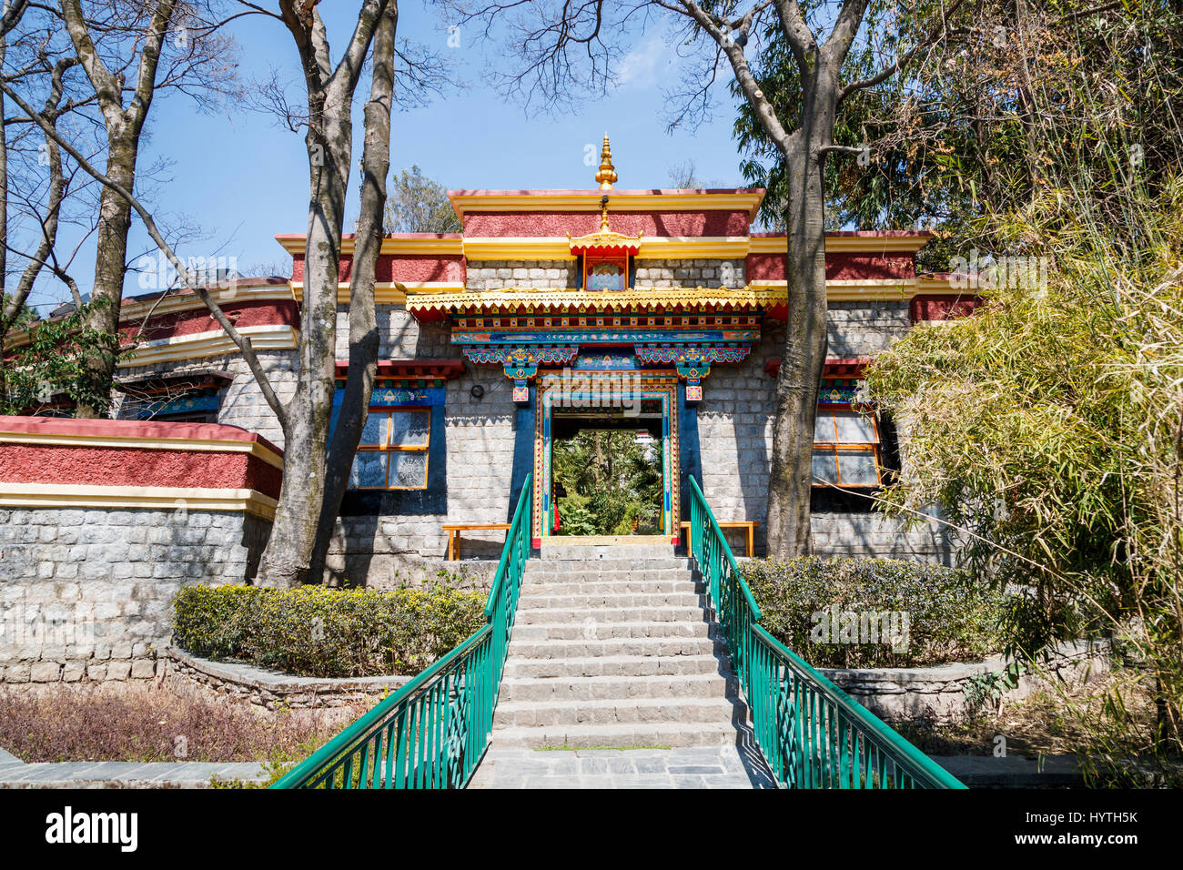 Ornate entrance gateway in the perimeter wall of the Norbulingka Institute, Sidphur, Dharamshala, Dharampur Himachal, north India Stock Photo