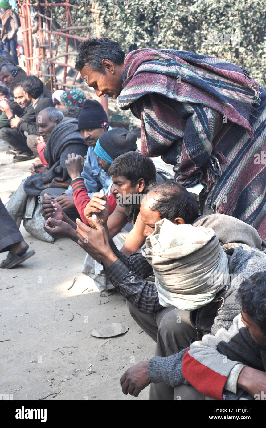 Street People waiting for food, food distribution camp. Delhi.(Photo Copyright © by Saji Maramon) Stock Photo