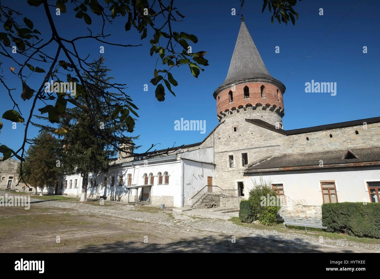 Inner courtyard and tower of Kamianets-Podilskyi castle in Western Ukraine. Shot on a beautiful clear autumn day with blue skies. Stock Photo