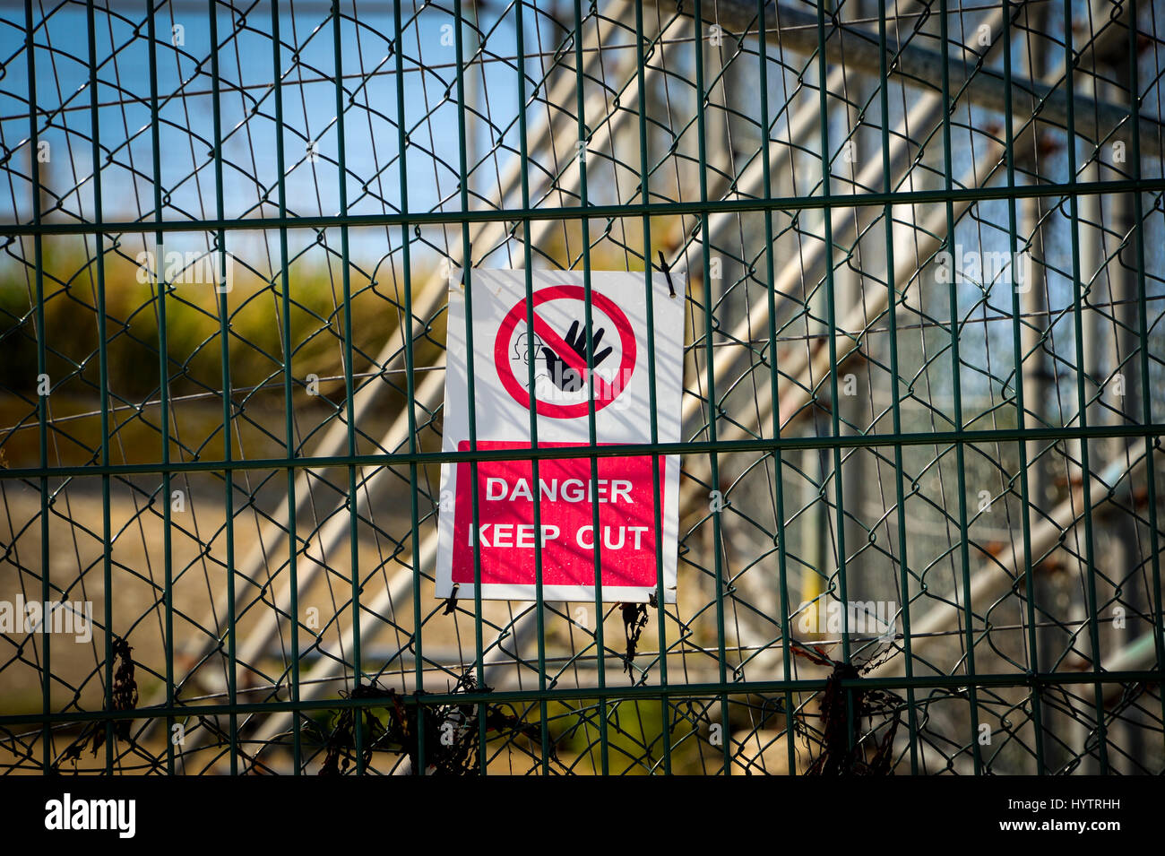 Danger keep out sign on a fence Stock Photo
