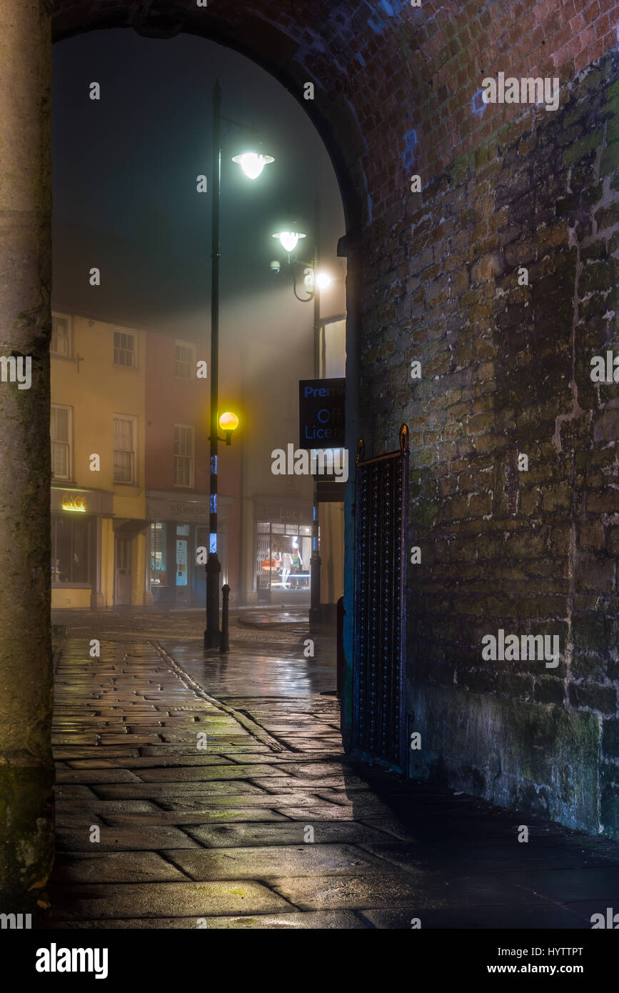 Birdcage Walk looking out from the abbey towards the Market Cross in the Wiltshire town of Malmesbury Stock Photo