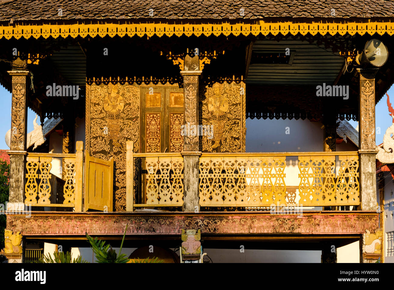 Exquisite wood carvings on the balcony of a teak house at Wat Luang Phrae Museum, Phrae, Thailand. Stock Photo