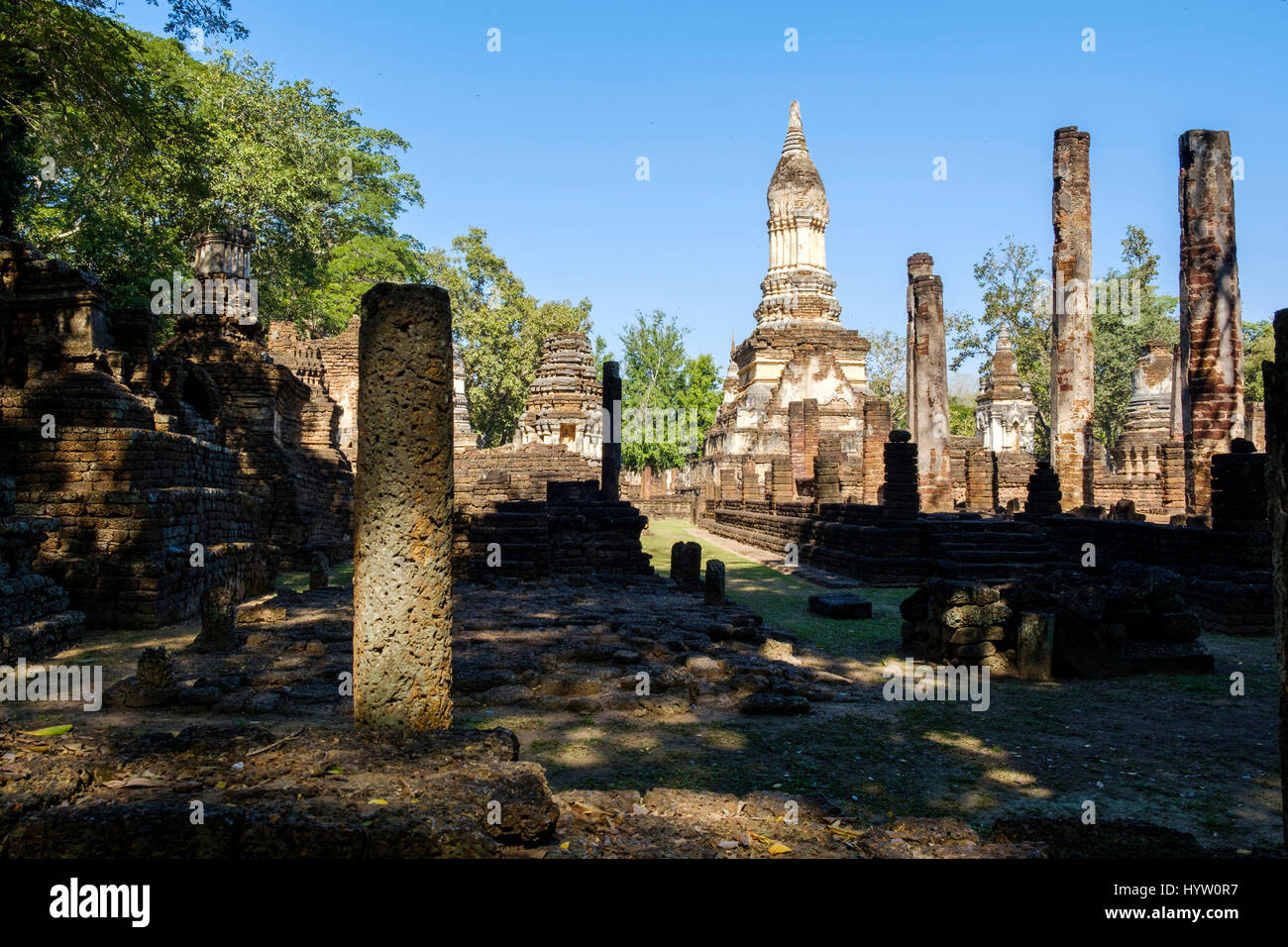 Stupa and columns at the ruins of Wat Chedi Chet Thaeo, a temple in Si Satchanalai Historical Park, Sukohthai Province, Thailand. Stock Photo