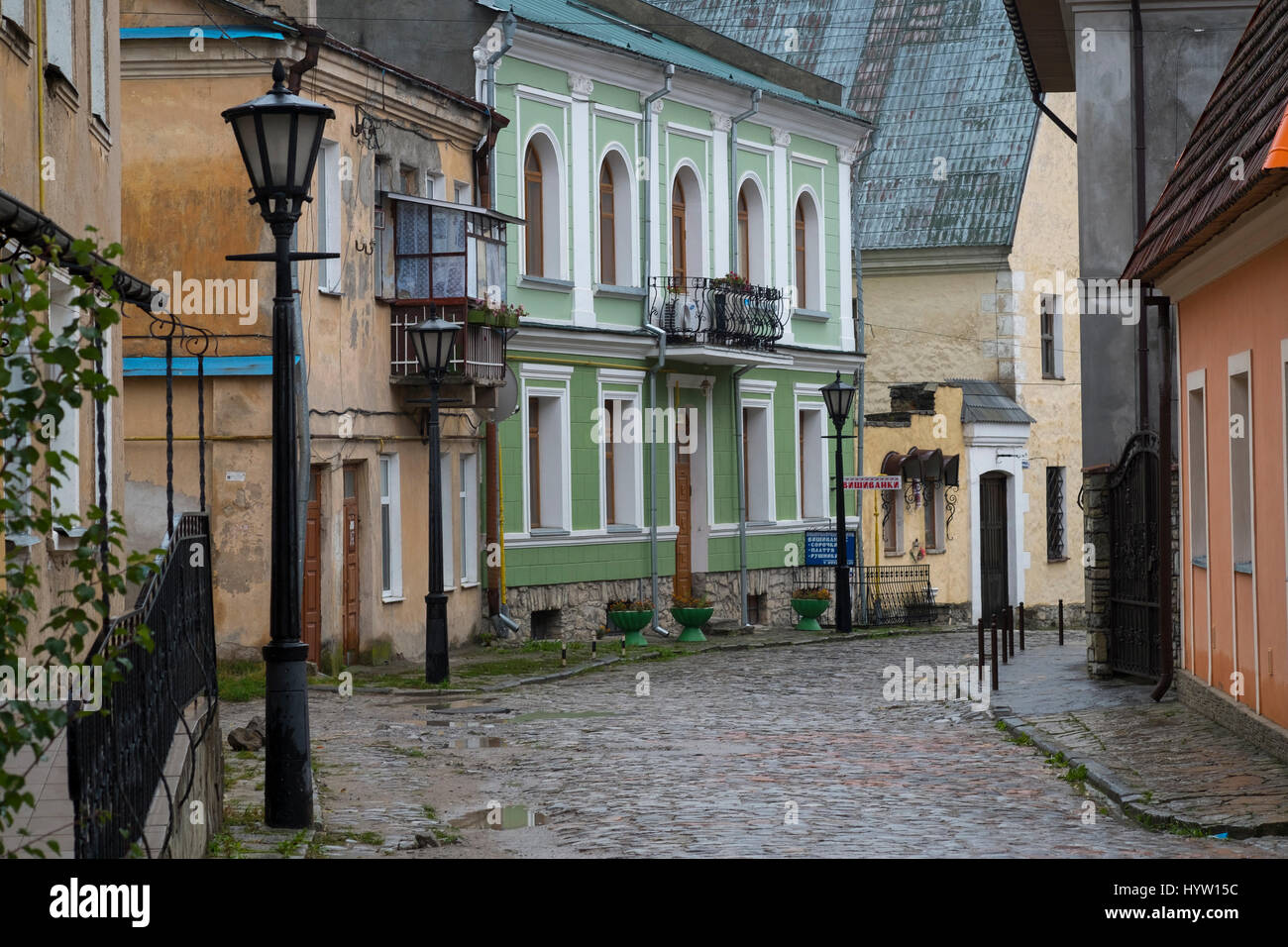 Deserted cobbled street in Kamianets-Podilskyi western Ukraine after heavy rainful Stock Photo