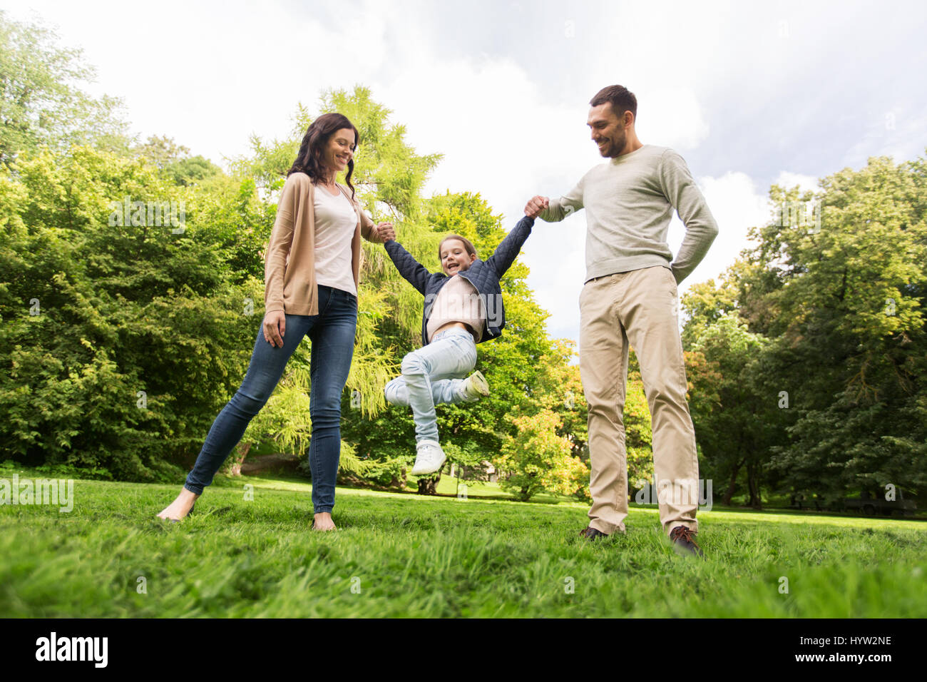 happy family walking in summer park and having fun Stock Photo - Alamy