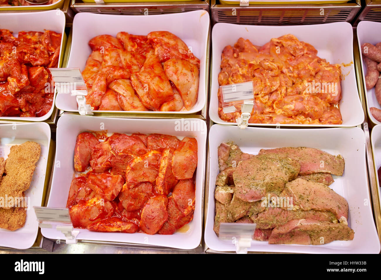 marinated meat in bowls at grocery stall Stock Photo Alamy