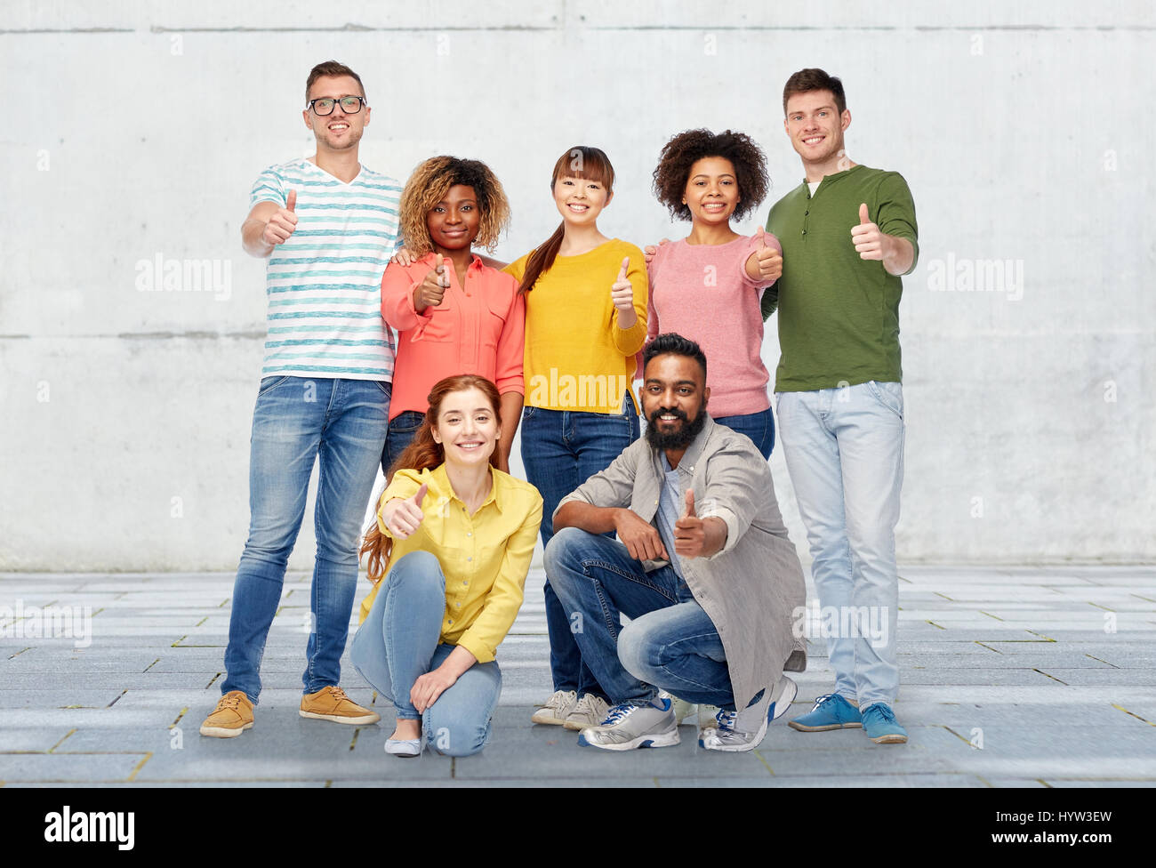 international group of people showing thumbs up Stock Photo - Alamy
