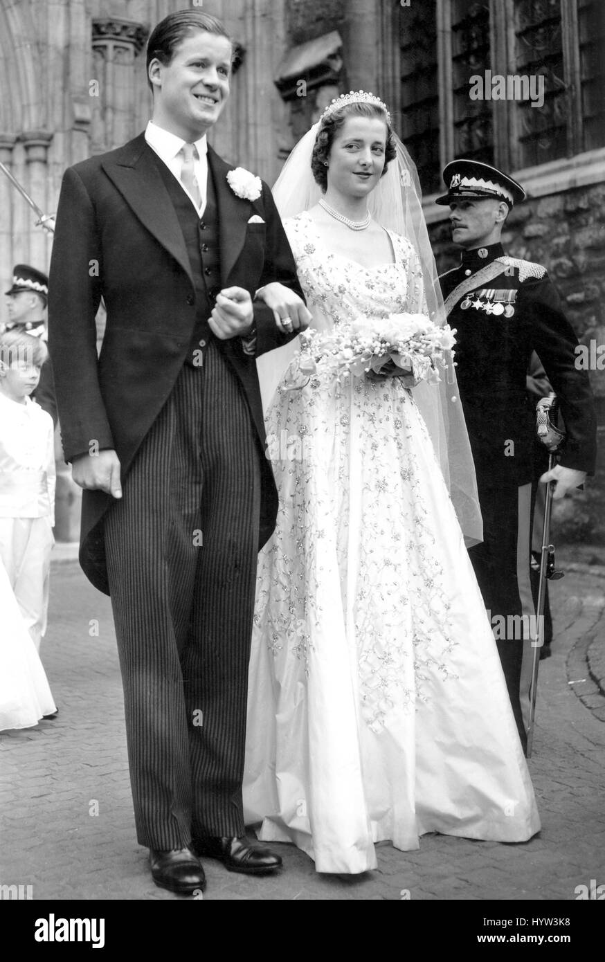 The 18-year-old bride and her bridegroom emerge from Westminster Abbey after the 'wedding of the year'. With the Queen, the Duke of Edinburgh and other members of the Royal family as guests, the former Miss Frances Roche, daughter of Lord and Lady Fermoy, was married in the Abbey to Viscount Althorp, 30, only son and heir of the Earl and Countess Spencer. Stock Photo