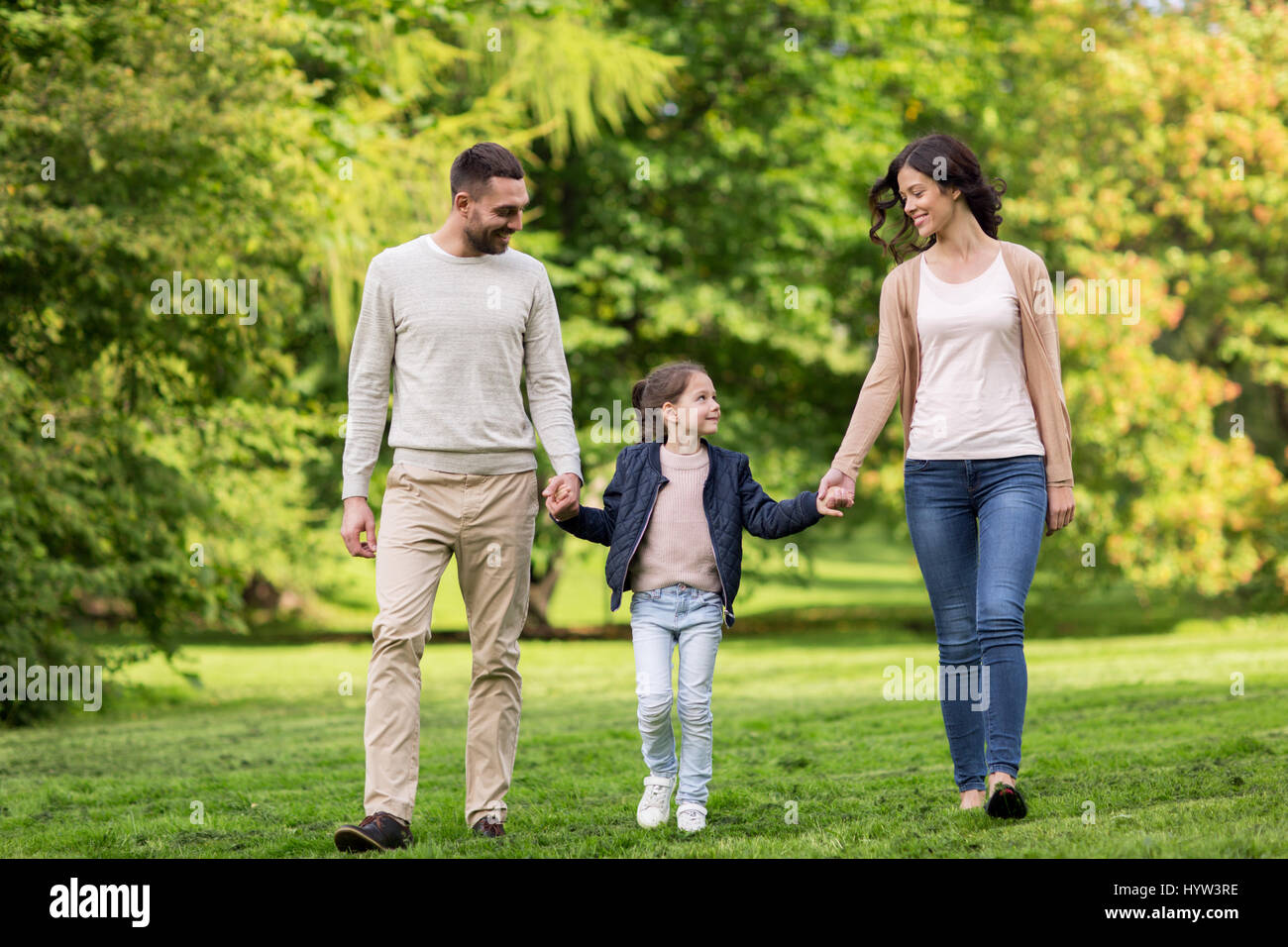 happy family walking in summer park Stock Photo - Alamy