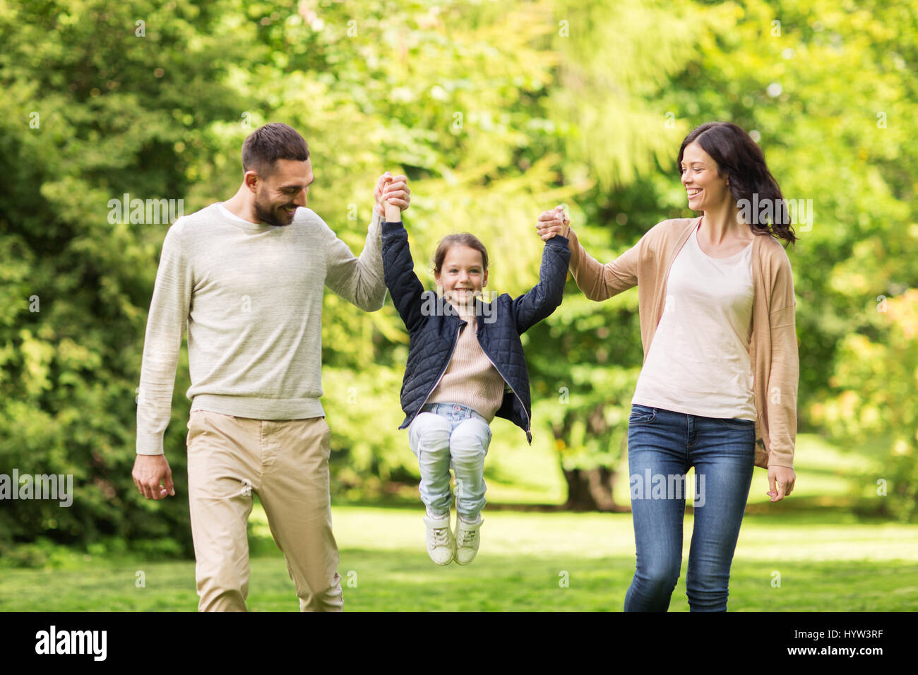 happy family walking in summer park and having fun Stock Photo - Alamy