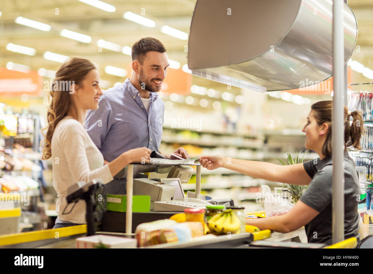 couple buying food at grocery store cash register Stock Photo Alamy