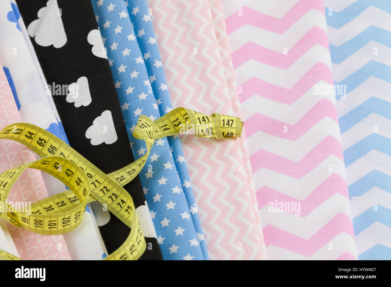 cotton fabric material and tailor measurement tape Stock Photo