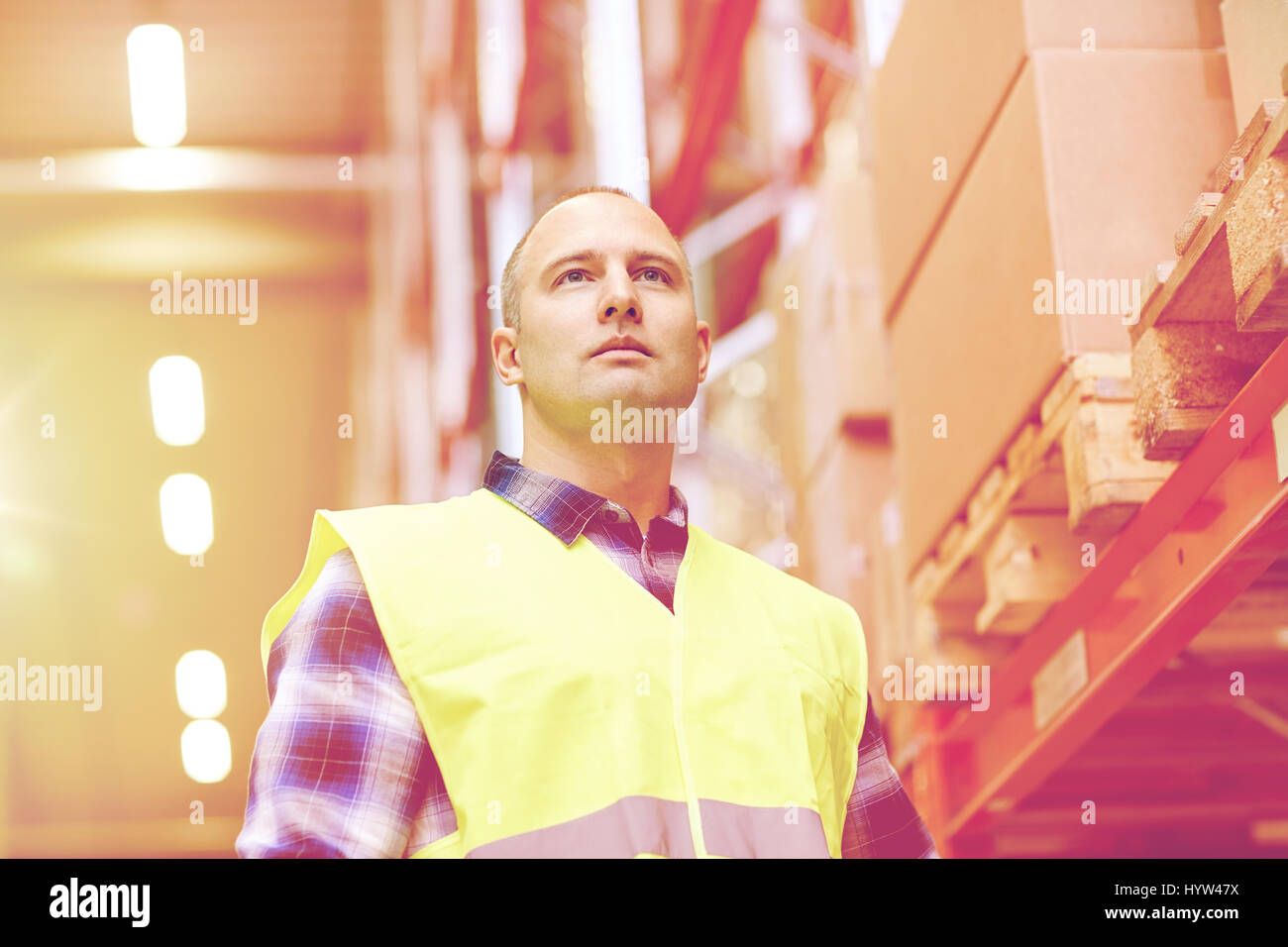 man in reflective safety vest at warehouse Stock Photo Alamy