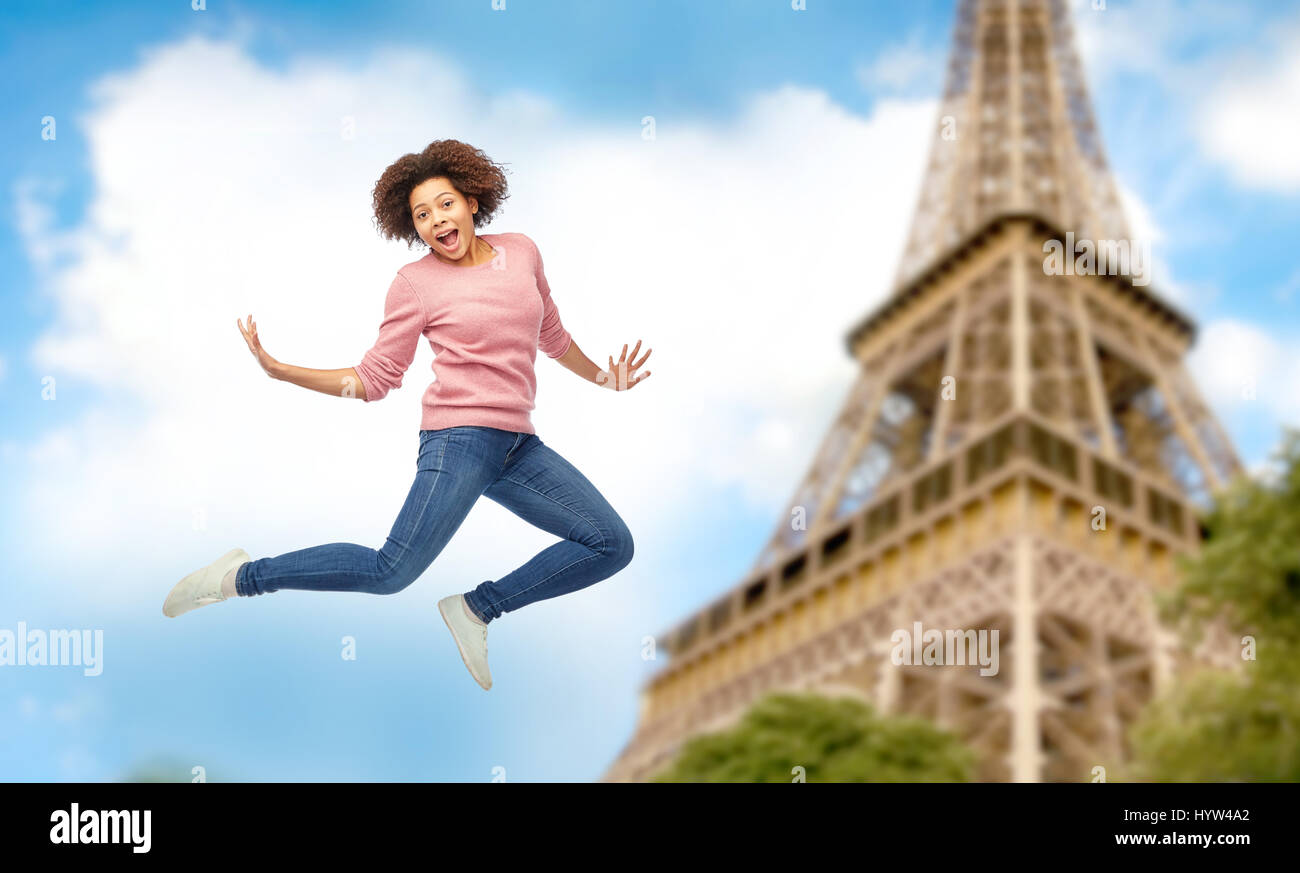 happy african american woman jumping over white Stock Photo - Alamy