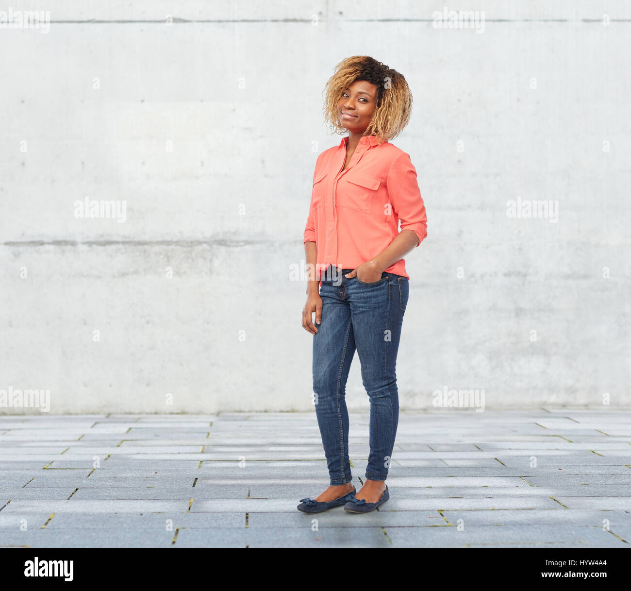 happy african american young woman over white Stock Photo - Alamy