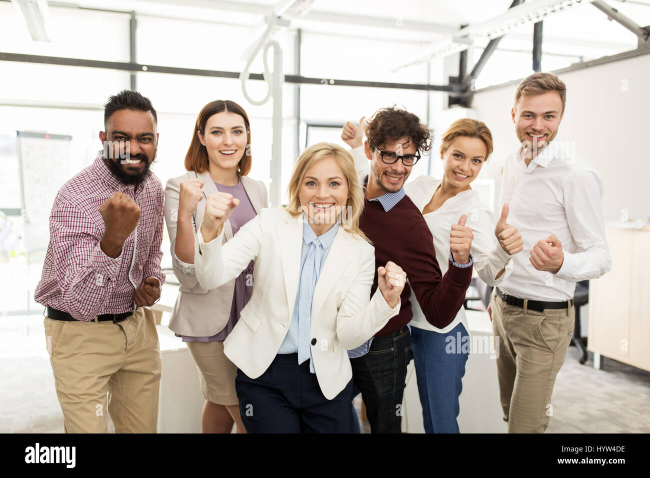 happy business team celebrating victory at office Stock Photo - Alamy