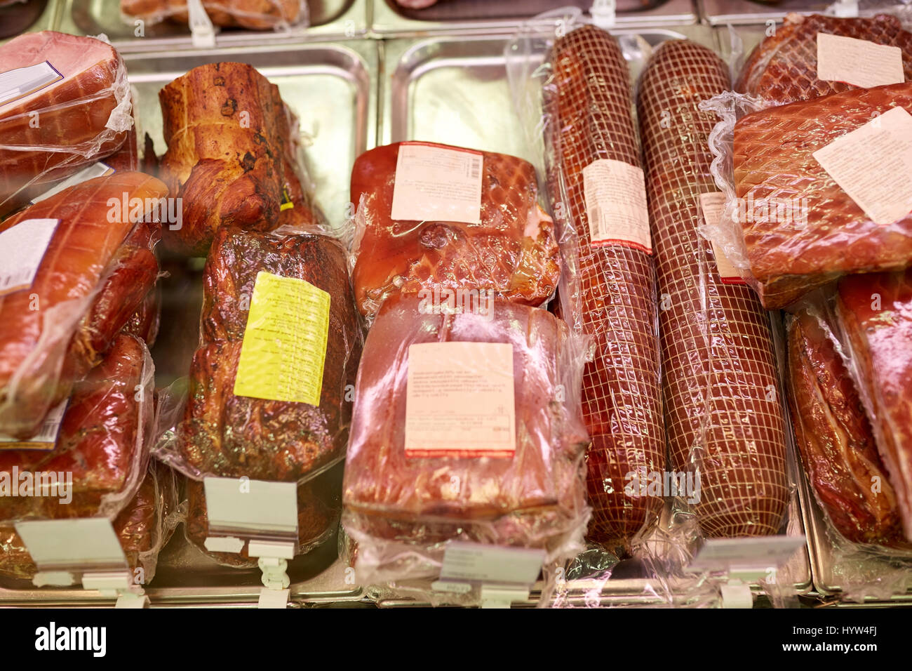 ham at grocery store stall Stock Photo Alamy
