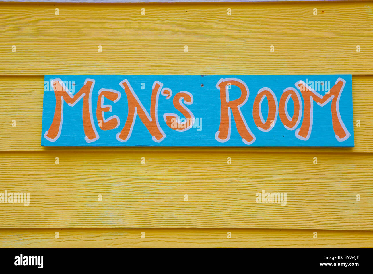 Hand painted mens room sign Stock Photo