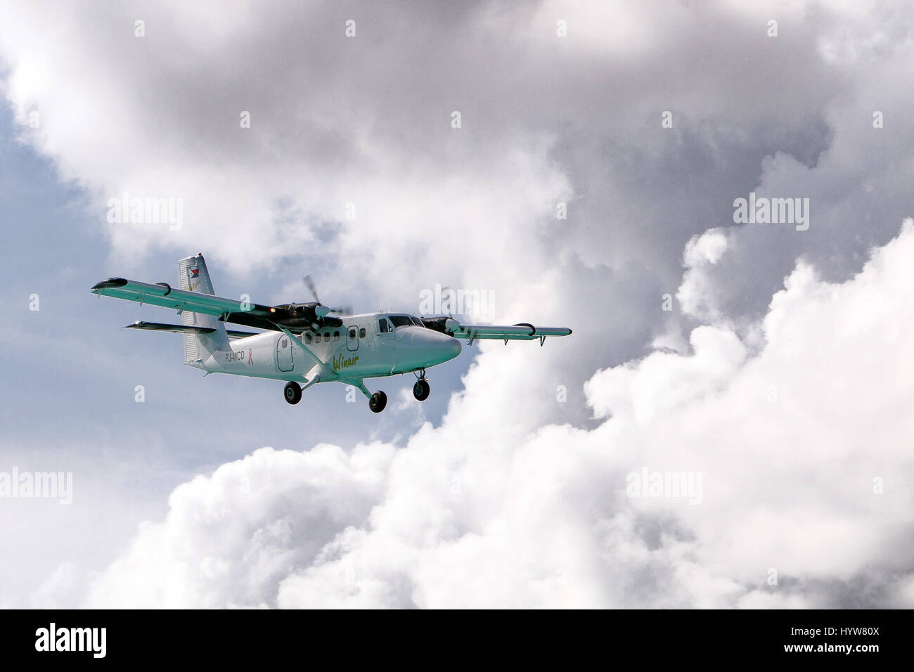 A Winair small plane prepares for landing at Princess Juliana airport. Stock Photo