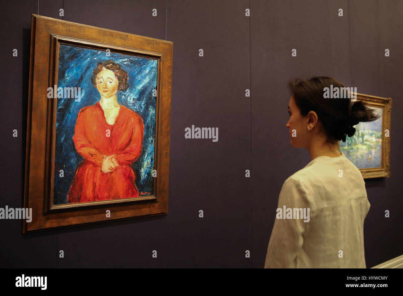 Sotheby's London, UK. 7th Apr, 2017. A member of staff looks at La Femme en rouge au fond bleu 1928 by Chaim Soutine Est $3m to $4m.  The piece is part of a collections from a range of artists including Andy Warhol, David Hockney and Monet that will be available at a Contemporary Art Evening Auction in New York on 18 May 2017, the pieces are on display in London from 7-12 April. Credit: Dinendra Haria/Alamy Live News Stock Photo