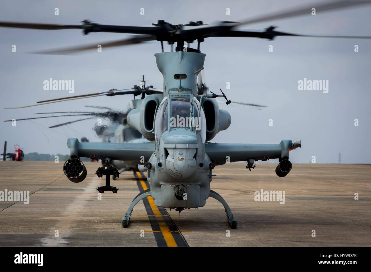 Owinawa, Japan. 26th Apr, 2017. A U.S. Marine Corps AH-1W Super Cobra attack helicopters begin pre-flight checks, prior to a Mission Rehearsal Exercise at Marine Corps Air Station Futenma April 26, 2017 in Okinawa, Japan. U.S. Forces across the Asian region have increased combat exercises as tensions continue to rise between the U.S. and North Korea. Credit: Planetpix/Alamy Live News Stock Photo