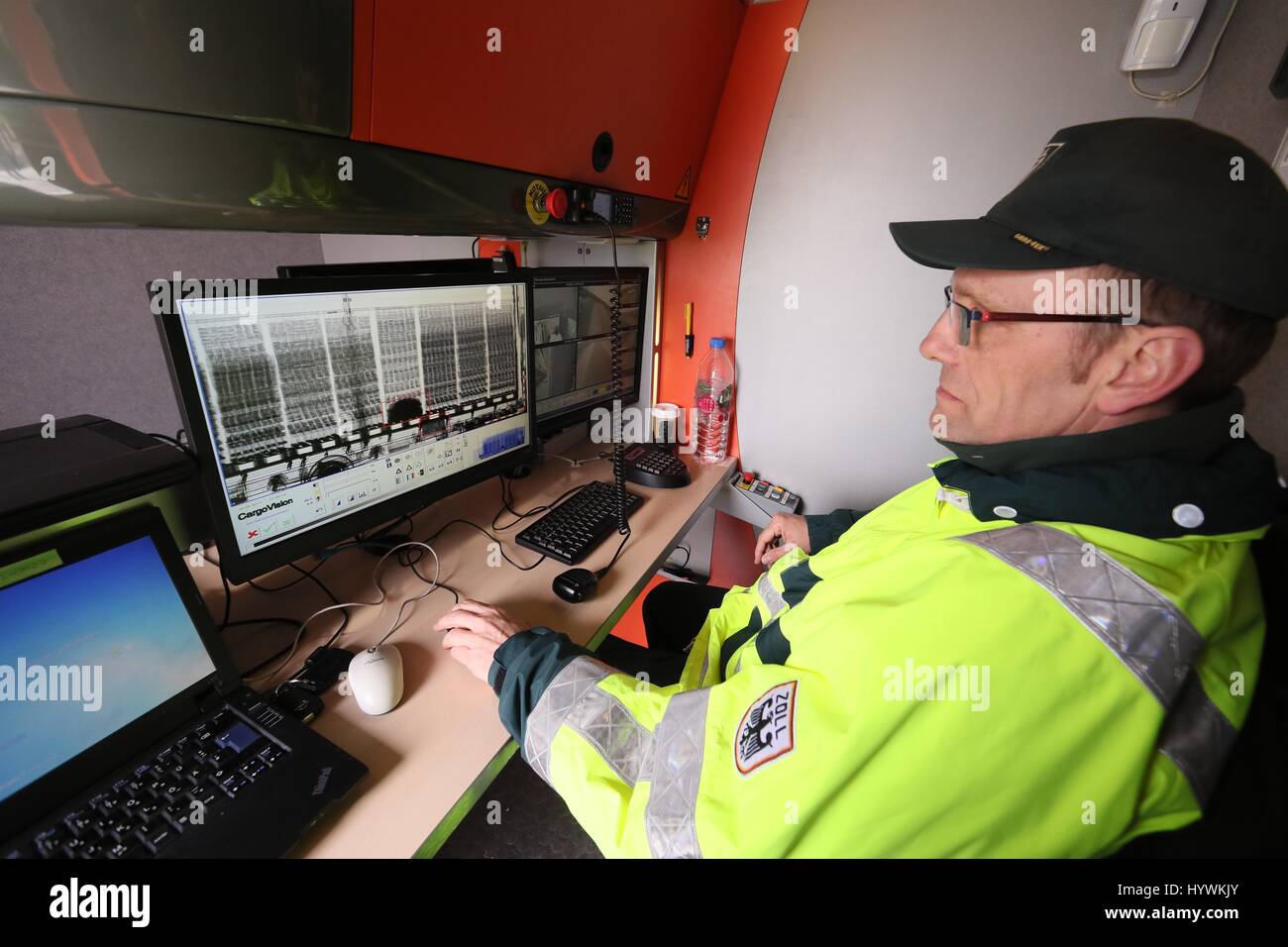 Schleiz, Germany. 26th Apr, 2017. A customs officer sits in front of an evaluation monitor on a Customs mobile X-ray device at a rest area of the Autobahn 9 near Schleiz, Germany, 26 April 2017. Passenger cars and trailer trucks were checked as part of a large control operation conducted by the Police, Customs, the Office for Occupational Safety and the Environmental Office. Photo: Bodo Schackow/dpa-Zentralbild/dpa/Alamy Live News Stock Photo