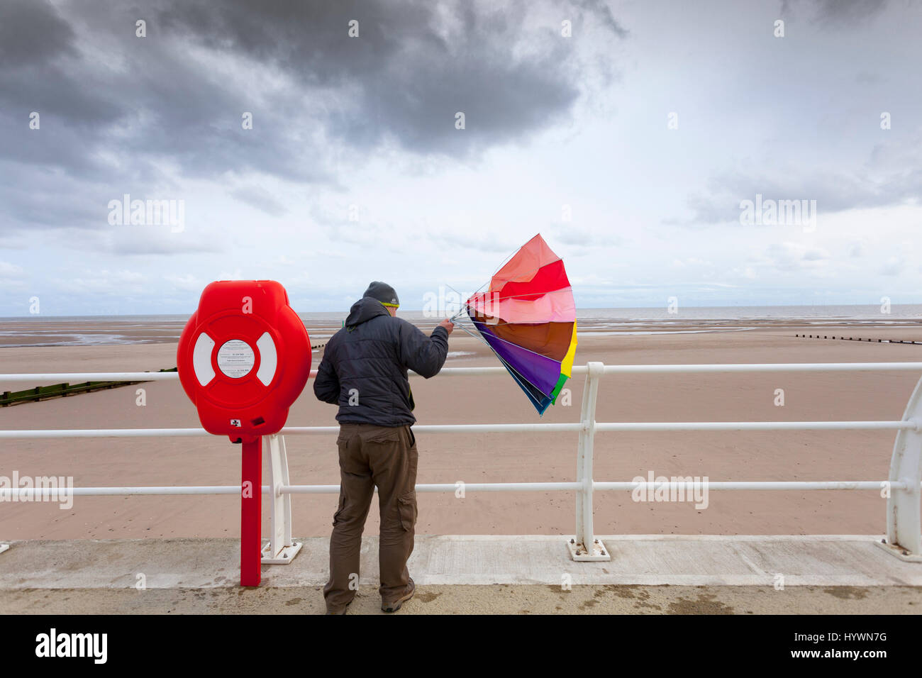 Windy day umbrella hires stock photography and images Alamy